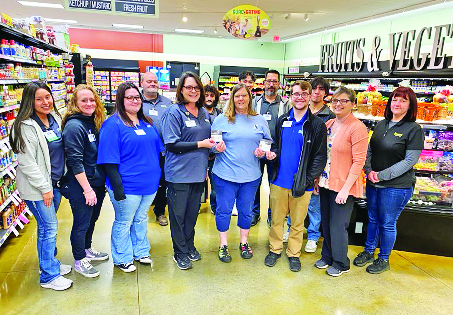 Harps Presents Gift Cards to Loaves & Fishes Carroll County News